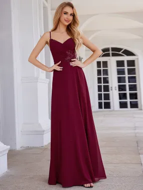 Robe de demoiselle d'honneur chic plissée à col en V et sans manches à la taille appliquée